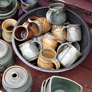 various pottery mugs, jars, and vases 