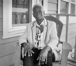 Fairolyn Livingston on the Frontporch of the Hannibal Square House she was born in, Winter Park, FL - 2025